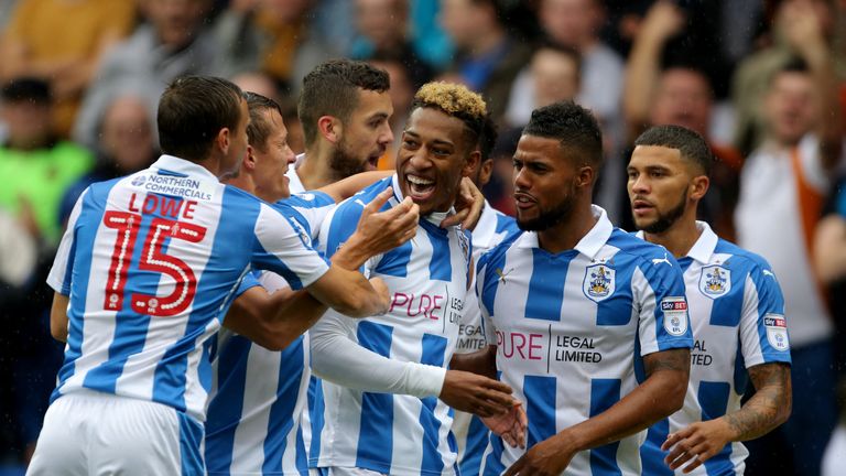 Huddersfield Town's Rajiv van La Parra (centre) celebrates his opening goal with team mates during the Sky Bet Championship match at the John Smith's Stadi