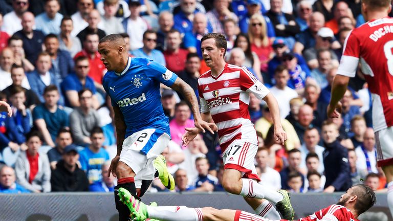 James Tavernier is tackled by Massimo Donati 