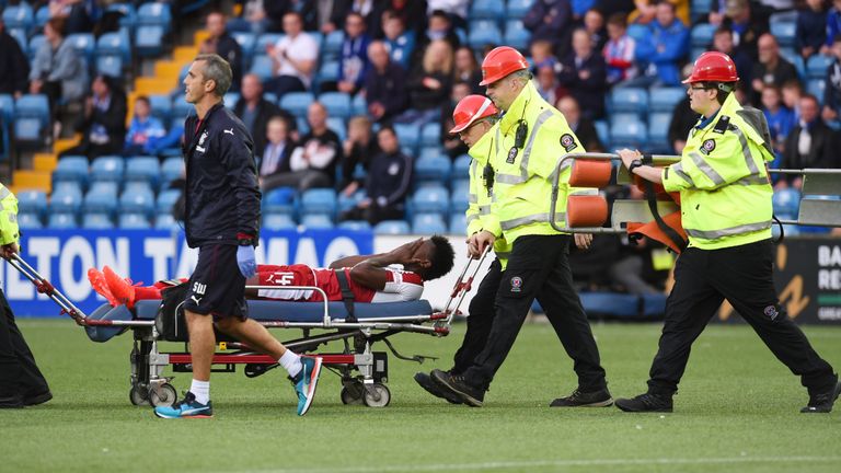 Joe Dodoo leaves the Rugby Park pitch after just 15 minutes