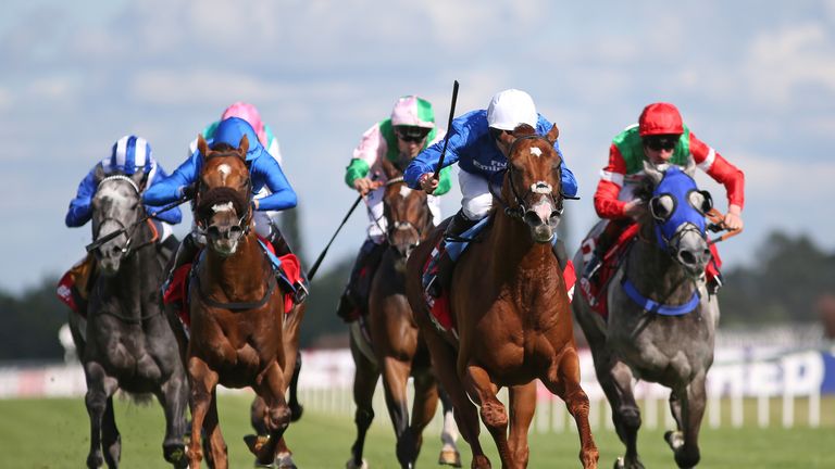 Robert Havlin riding Richard Pankhurst (centre, white cap) wins the Betfred Hungerford Stakes at Newbury 