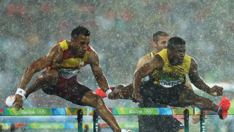 Rain lashed down in the early stages of the men's 110m hurdles