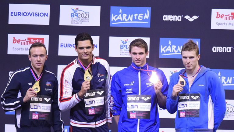 (L-R) Joint winners France's Florent Manaudou and Belarus' Yauhen Tsurkin hold their gold medals next to Joint third placed Ukraine's Andriy Govorov and Gr