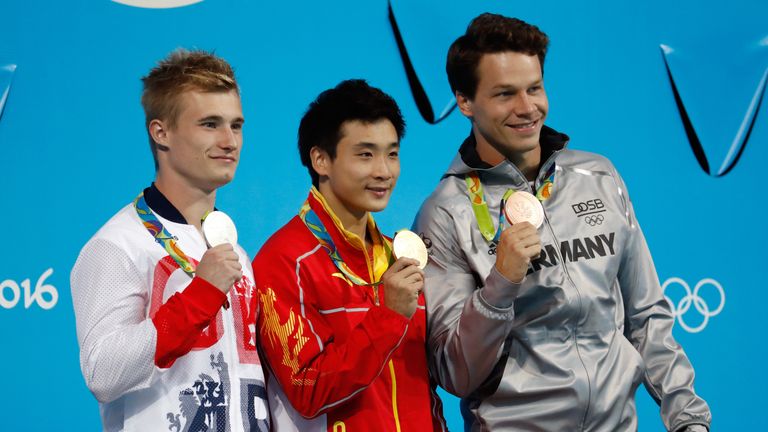  (L-R) Silver medalist Jack Laugher of Great Britain, gold medalist Yuan Cao of China and bronze medalist Patrick Hausding