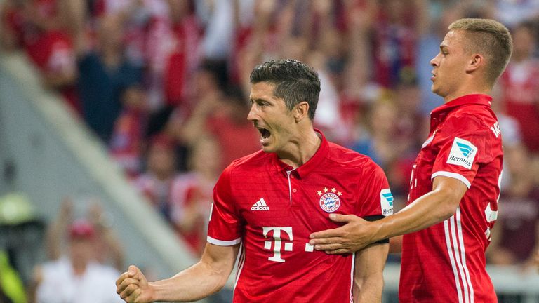 Robert Lewandowski (L) and Joshua Kimmich of Bayern Munich celebrate after scoring the 6:0 during the Bundesliga match between