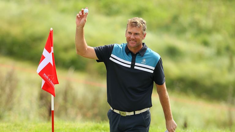 Robert Karlsson celebrates his hole in one at the 16th