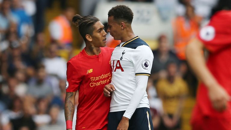 Roberto Firmino (L) and Dele Alli face up to each other during the game at White Hart Lane