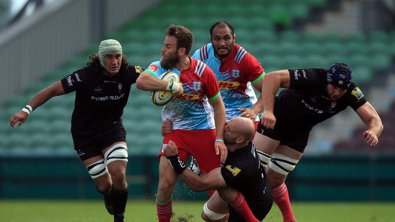 LONDON, ENGLAND - AUGUST 13:  Ruaridh Jackson of Harlequins is tackled by George Robson of London Irish (R) during the Cunningham - Duncombe Series match b