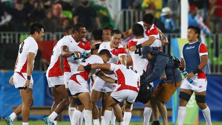 Japan celebrate after their quarter-final win over France