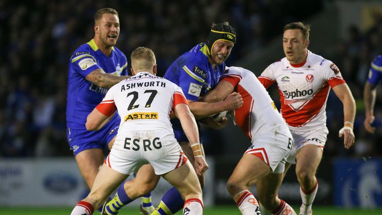  Chris Hill is tackled by St Helens duo Jon Wilkin and Jack Ashworth