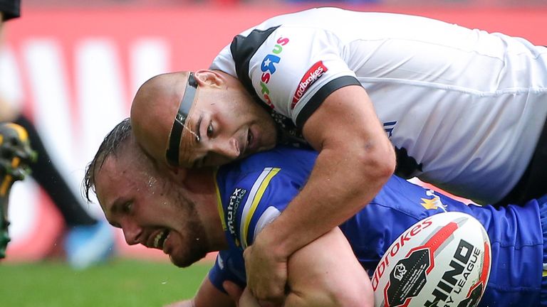 Danny Houghton makes a match-saving tackle on Warrington's Ben Currie in the Challenge Cup final