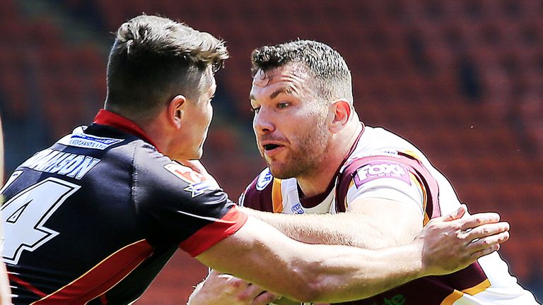 Dewsbury's Luke Adamson tackles Batley's Keegan Hirst