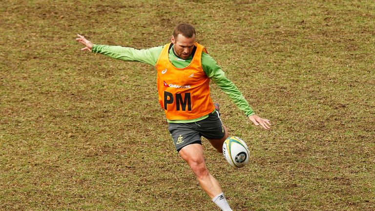 Matt Giteau kicks during an Australia training session