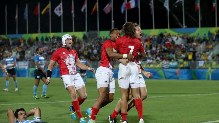 Argentina look dejected as Great Britain celebrate