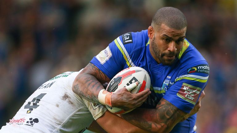 Warrington's Ryan Bailey is tackled by Widnes' Chris Dean.