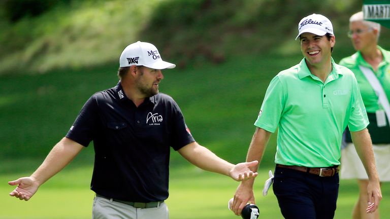 SILVIS, IL - AUGUST 14:  Ryan Moore and Ben Martin walk down the eighth fairway during the final round of the John Deere Classic at TPC Deere Run on August