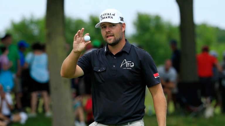 SILVIS, IL - AUGUST 14:  Ryan Moore acknowledges the crowd after his birdie on the tenth hole during the final round of the John Deere Classic at TPC Deere