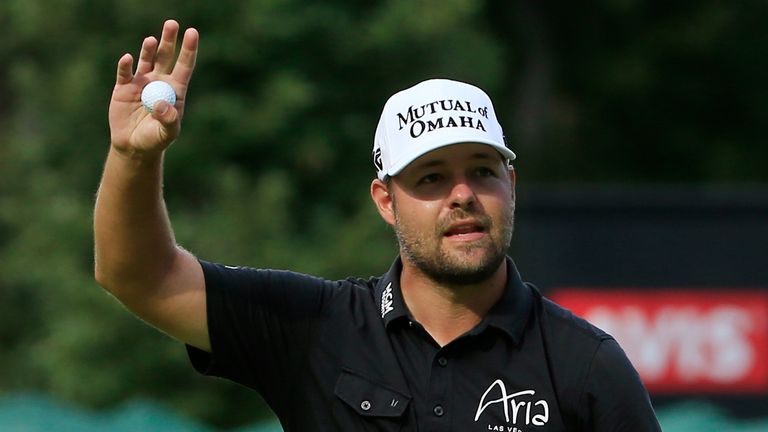 Ryan Moore acknowledges the crowd after his winning putt on the 18th green during the final round of the John Deere Classic