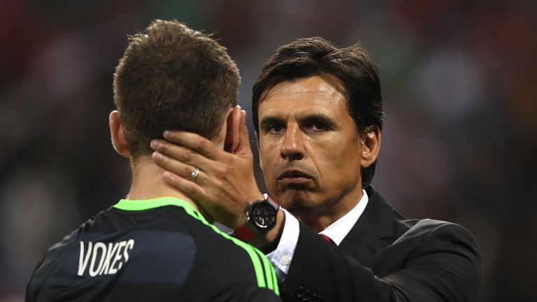 LYON, FRANCE - JULY 06:  Wales Manager / Head Coach Chris Coleman consoles Sm Vokes at the end of the UEFA Euro 2016 Semi Final match between Portugal and 