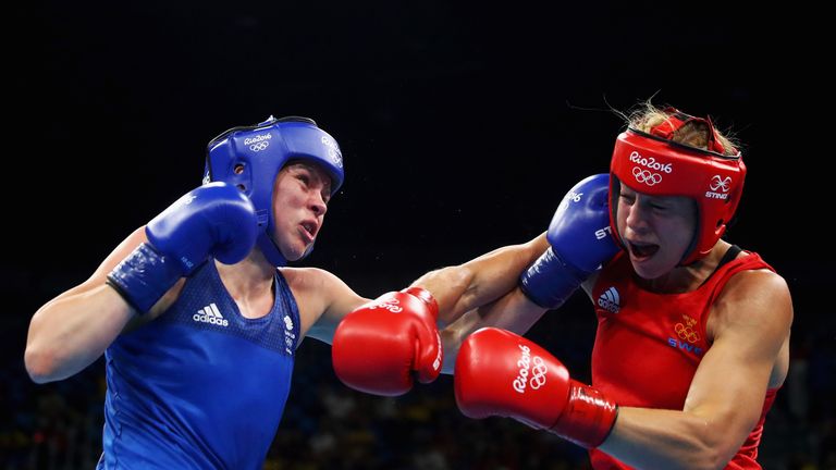 Savannah Marshall of Great Britain or Team GB (blue) and Anna Laurell Nash of Sweden compete in their Middleweight 75 