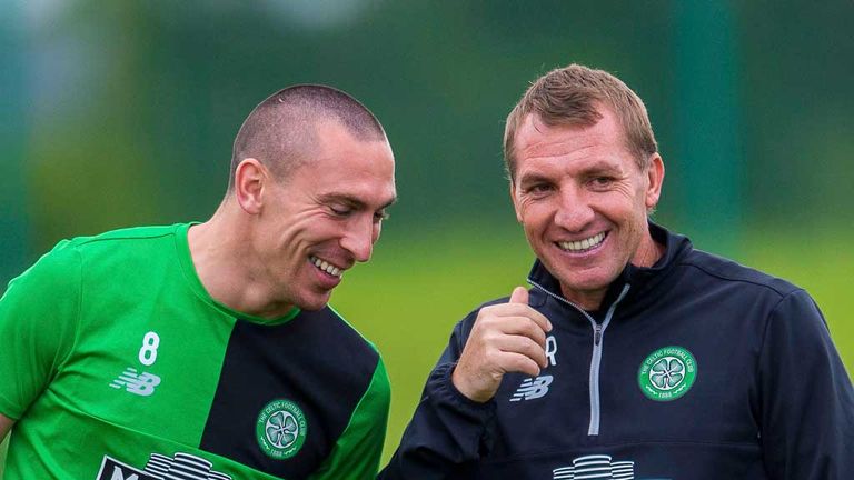 Scott Brown and Brendan Rodgers share a joke during training at Lennoxtwon