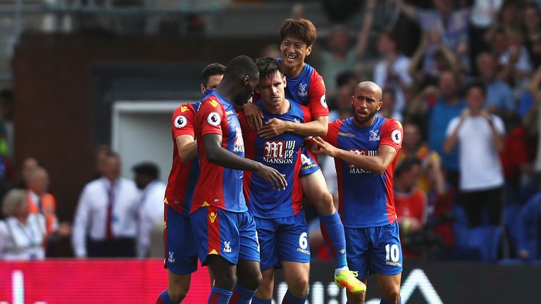 Scott Dann of Crystal Palace (C) celebrates scoring his side's equaliser