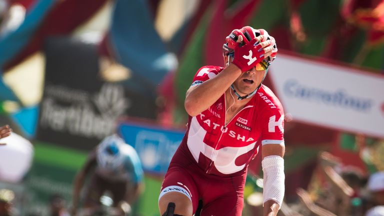 Sergey Lagutin celebrates winning as he crosses the finish line during the 8th stage of the 71st edition of the Vuelta a Espana
