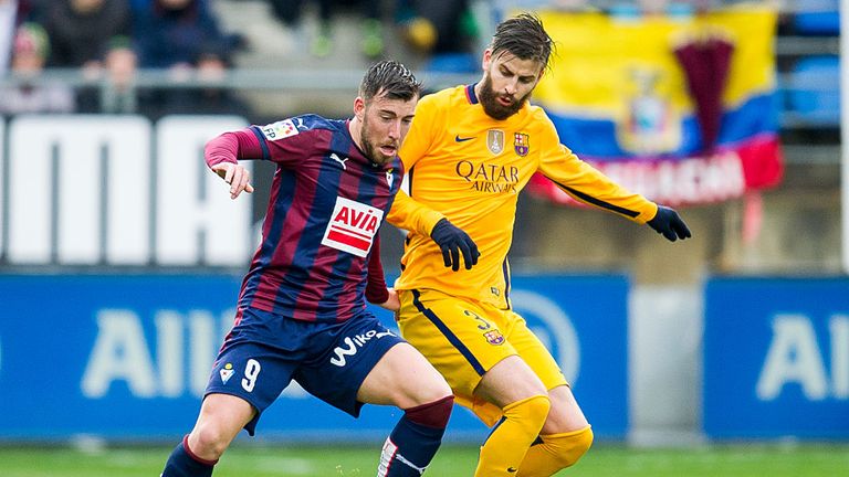 Sergi Enrich shields the ball away from Barcelona's Gerard Pique