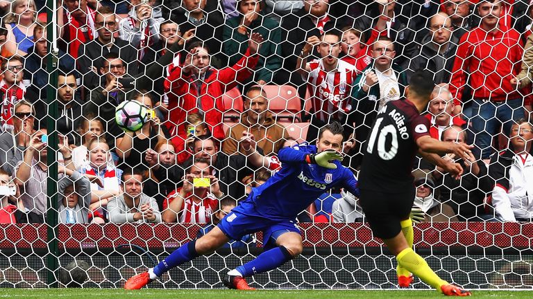 Sergio Aguero of Manchester City scores his sides first goal past Shay Given of Stoke City 