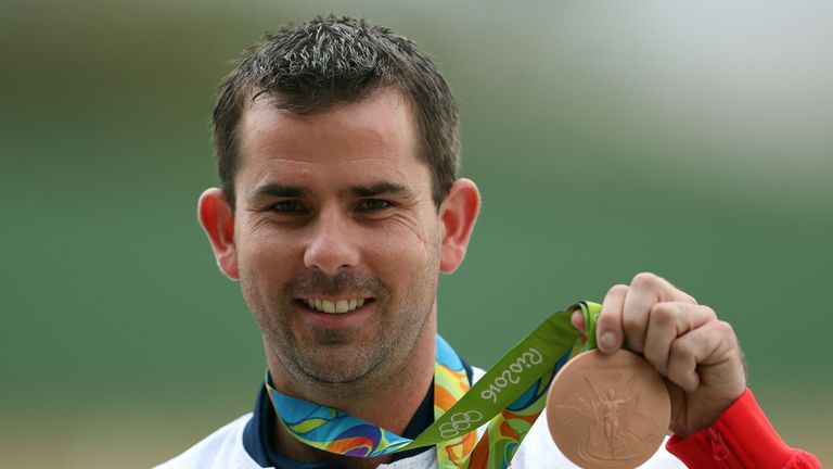 Edward Ling shows off his bronze medal