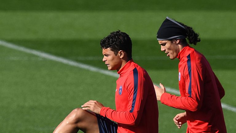 Paris Saint-Germain's Brazilian defender Thiago Silva (L) and Uruguyan forward Edinson Cavani attend a training session on April 5, 2016 in Saint-Germain-e