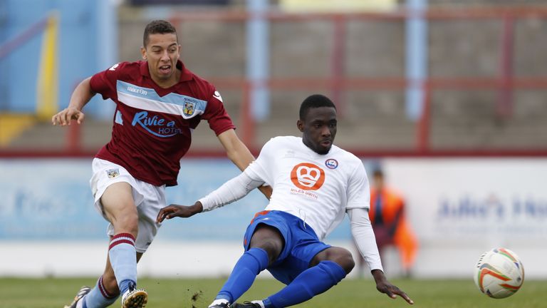 WEYMOUTH, ENGLAND - OCTOBER 25: Simeon Akinola (right) of Braintree Town shoots wide as he is tackled by Calvin Brooks of Weymouth during FA Cup Qualifying