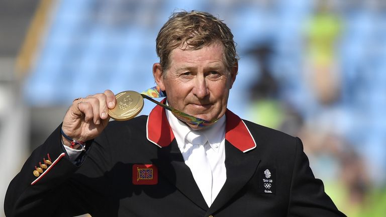 Britain's Nick Skelton poses with his gold medal in the individual equestrian show jumping event at the Olympic Equestrian Centre during the Rio 2016 Olymp