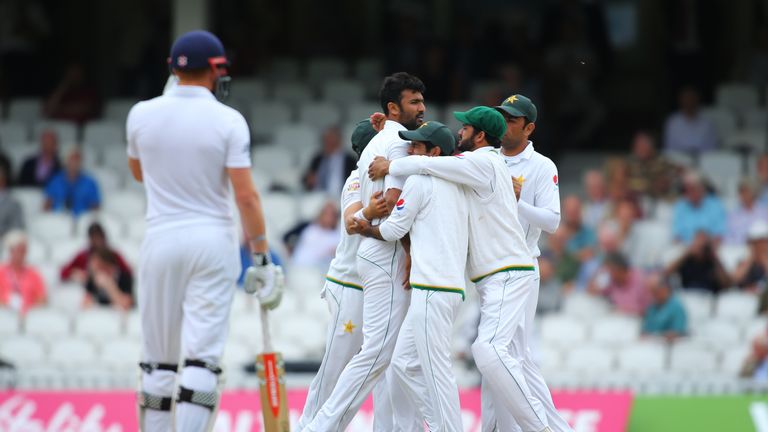 Sohail Khan of Pakistan celebrates with his teammates after getting the wicket of Gary Ballance