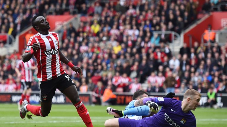Southampton's Sadio Mane (L) celebrates after scoring past Manchester City's goalkeeper Joe Hart (R) during the English Premier League game in May 2016