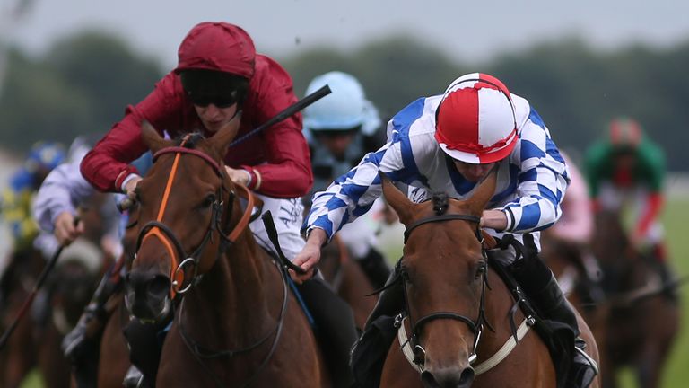 Ryan Moore riding Sweet Selection (right) at Newbury
