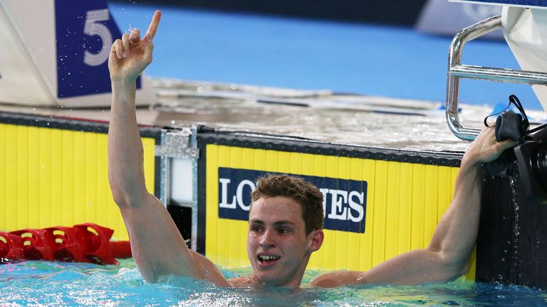 Benjamin Proud celebrates winning the gold medal in the Men's 50m Butterfly Final at the 2014 Commonwealth Games