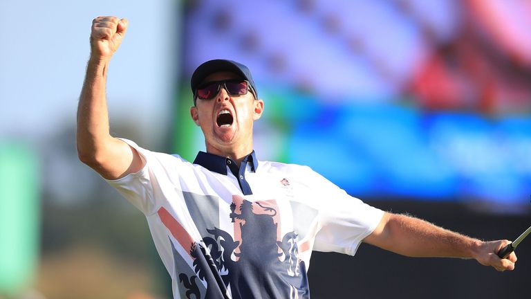 Great Britain's Justin Rose celebrates winning gold in the men's golf
