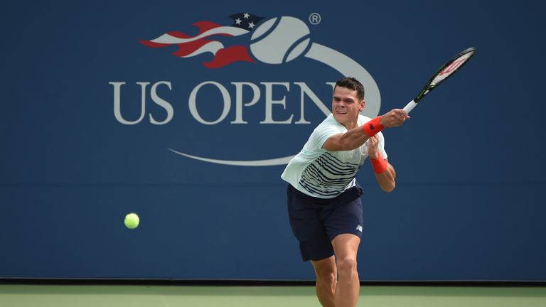 Milos Raonic of Canada returns a shot against Ryan Harrison during their US Open 2016 match