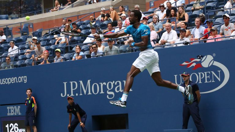 Gael Monfils of France serves to Jan Satral of Czech Republic during the 2016 US Open
