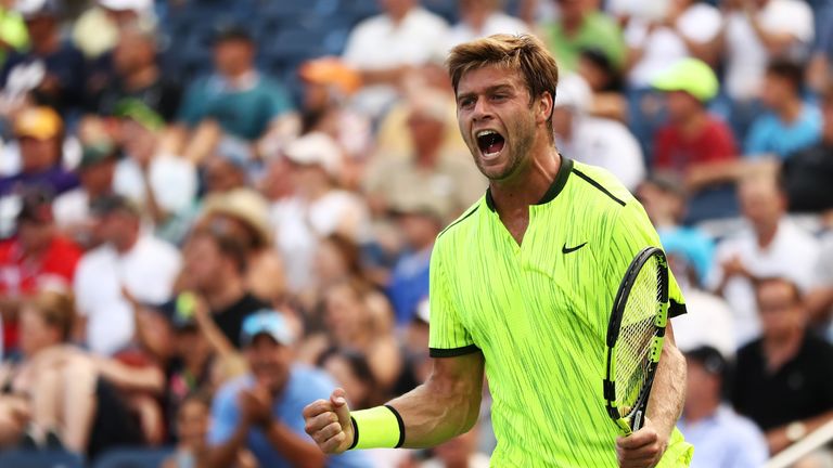 Ryan Harrison of the United States celebrates his win over Milos Raonic of Canada at the US Open