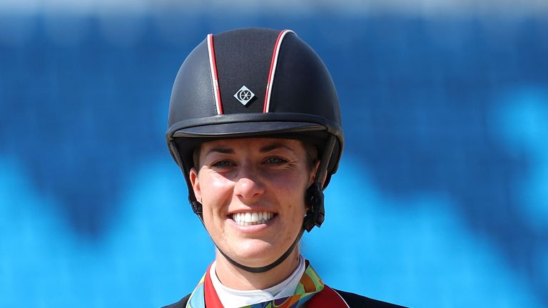 Charlotte Dujardin of Great Britain riding Valegro celebrates her gold medal