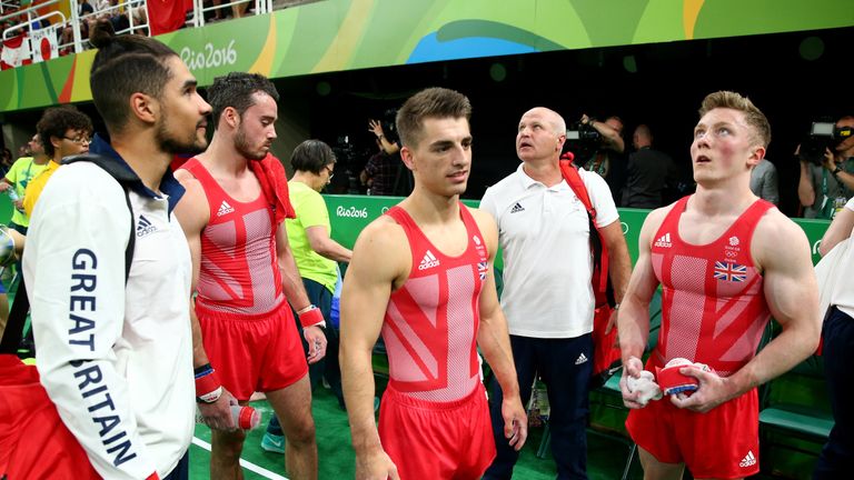 RIO DE JANEIRO, BRAZIL - AUGUST 08:  Louis Smith and Max Whitlock of Great Britain move to the next apparatus during the men's team final on Day 3 of the R