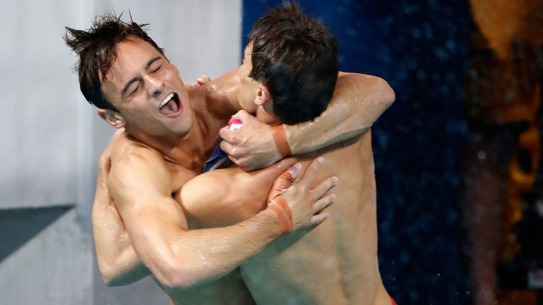 Tom Daley and Daniel Goodfellow of Great Britain celebrate winning bronze