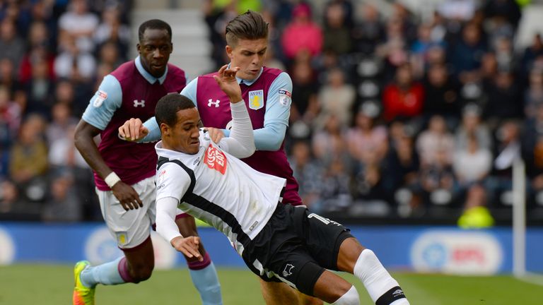 Derby County's Tom Ince is tackled by Aston Villa's Jack Grealish during the Sky Bet Championship match at the iPro Stadium, Derby.