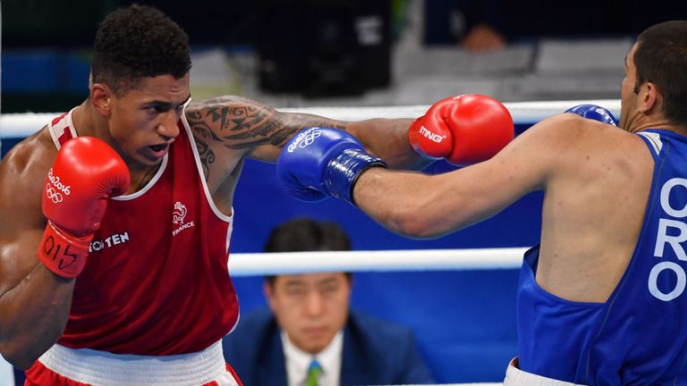 France's Tony Victor James Yoka (red) fights Croatia's Filip Hrgovic (blue) during the Men's Super Heavy (+91kg) Semifinal 1 at the Rio 2016 Olympic Games 