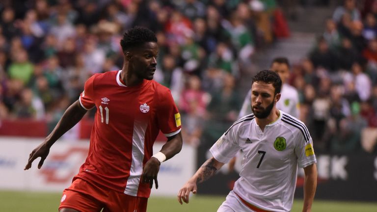 Canada's Tosaint Ricketts (L) vies for the ball agaist Mexico Miguel Layunduring their 2018 FIFA World Cup Russia, qualifier action at BC Place Stadium in 
