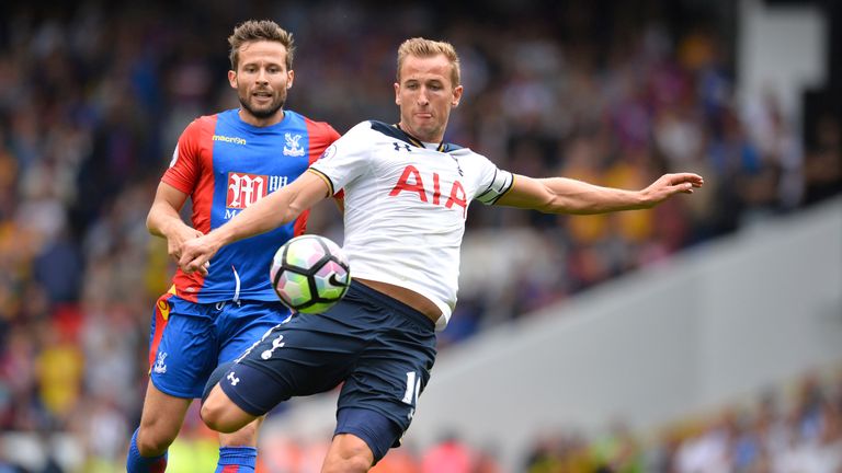 Harry Kane (R) hits a shot towards goal under pressure from Yohan Cabaye