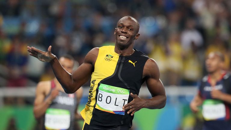 Jamaica's Usain Bolt celebrates winning gold in the 100m