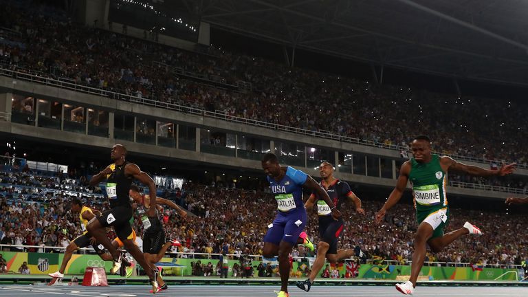 Usain Bolt of Jamaica celebrates as he wins the 100m final 