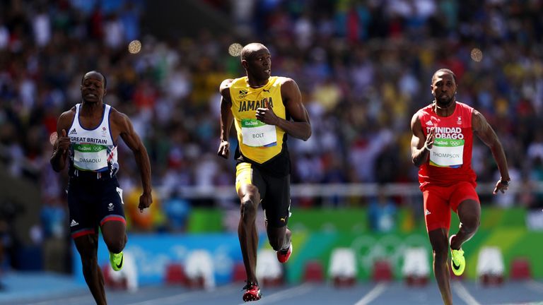 Usain Bolt (C) of Jamaica, Richard Thompson of Trinidad and Tobago and James Dasaolu of Great Britain compete in the men's 100m at the Olympics in Rio
